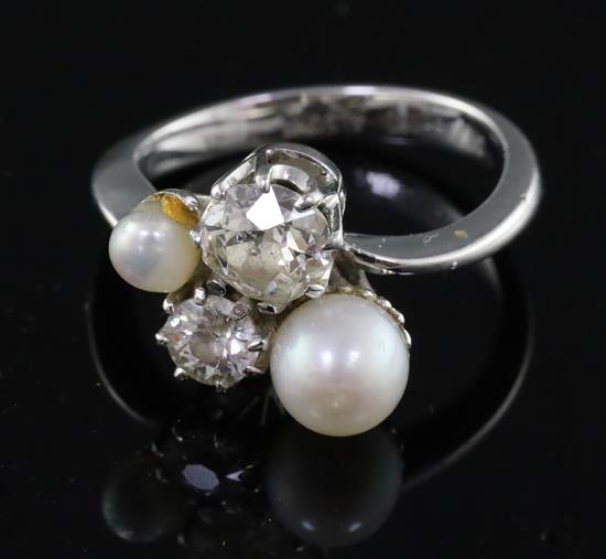 A white gold? and graduated two stone diamond and two stone cultured pearl set dress ring by C. Azzopardi & Sons, size O.